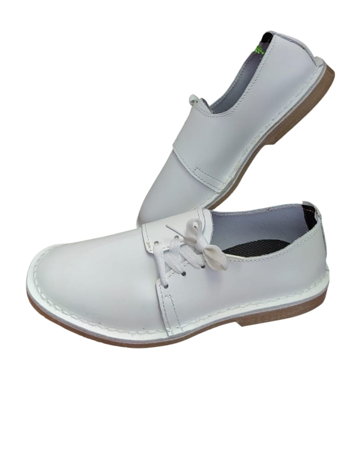 Ladies leather side lace vellies in white on a white background, side view