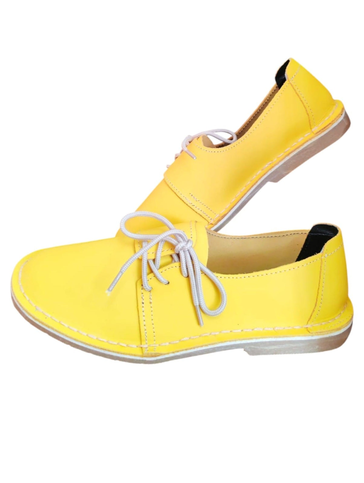 Ladies leather side lace vellies in yellow on a white background