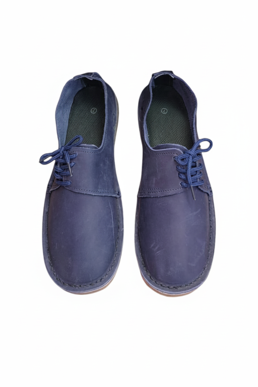 Ladies leather side lace vellies in navy on a white background, top view