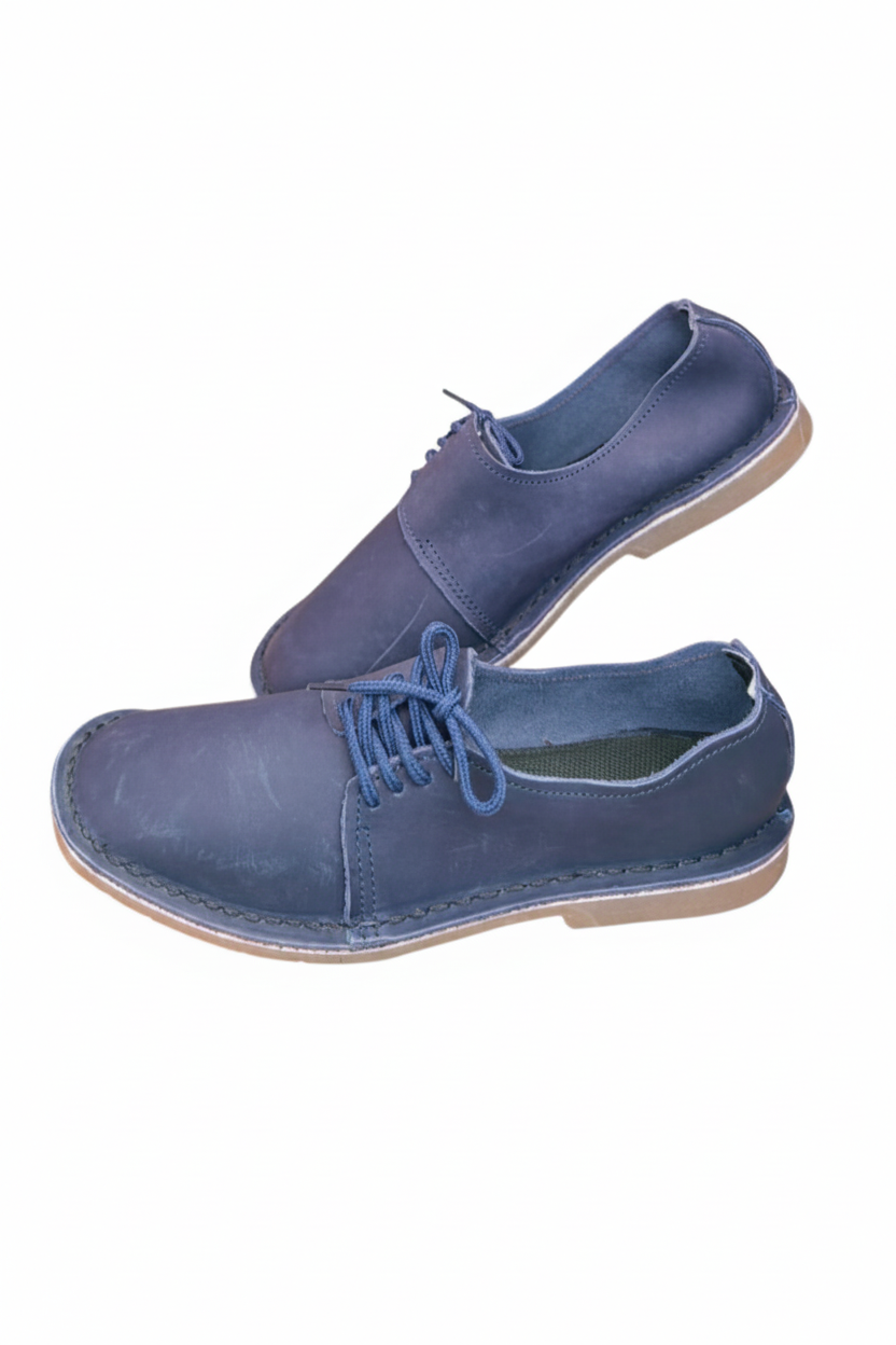 Ladies leather side lace vellies in navy on a white background, side view